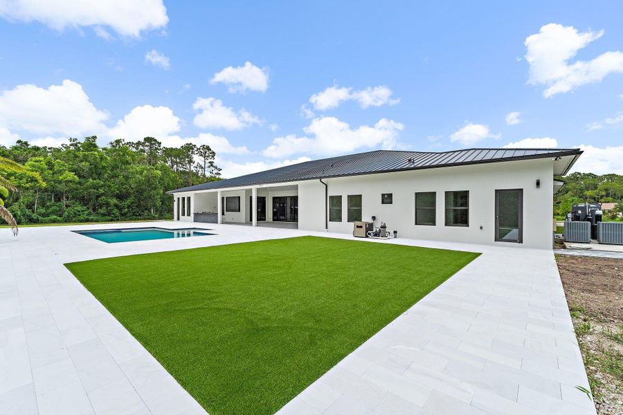 Front exterior of a new home in , Jupiter, FL, highlighting curb appeal (Image 32).
