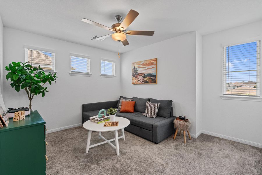 Upstairs loft with natural lighitng and celiing fan