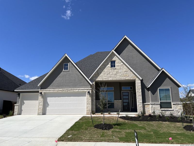 Front exterior of a new home in Mesa Western, Cibolo, TX, highlighting curb appeal (Image 2).