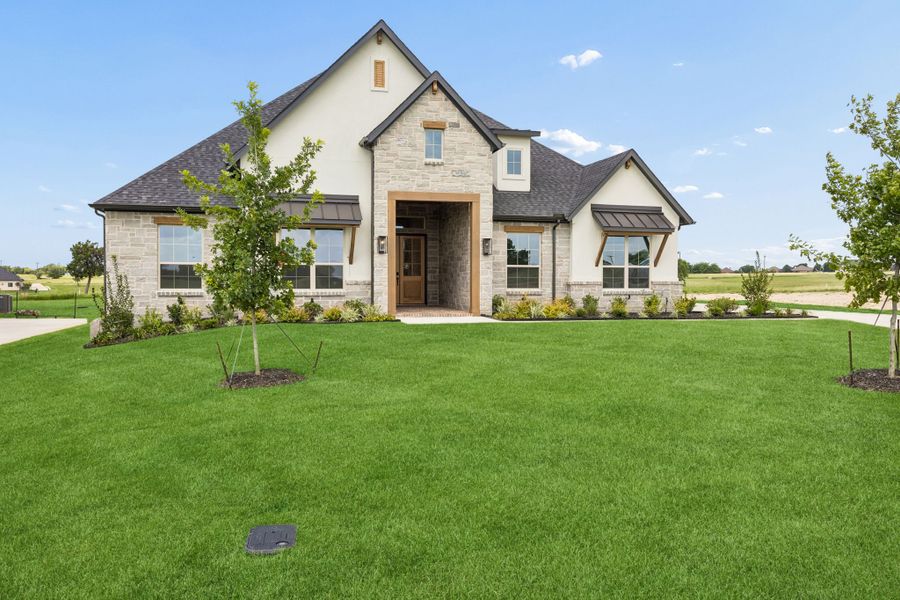 Front exterior of a new home in The Retreat, Cleburne, TX, highlighting curb appeal (Image 18). Front exterior of a new home in The Retreat, Cleburne, TX, highlighting curb appeal (Image 18).