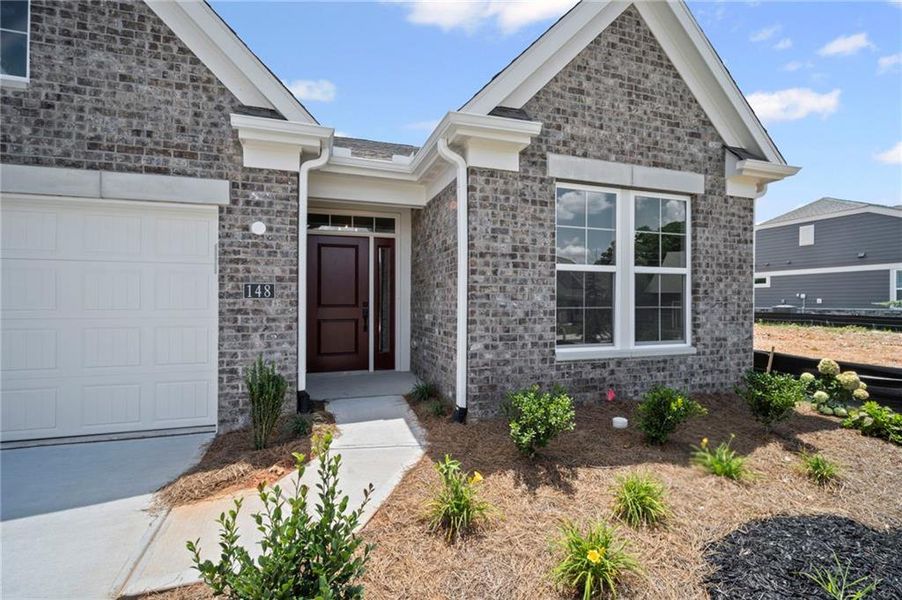 Front exterior of a new home in Laurel Farms, Dallas, GA, highlighting curb appeal (Image 2).