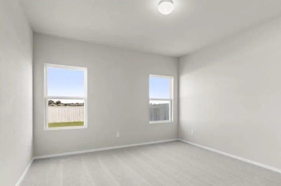Unfurnished room featuring light colored carpet