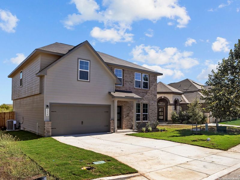 Front exterior of a new home in Horizon Pointe, Converse, TX, highlighting curb appeal (Image 17). Front exterior of a new home in Horizon Pointe, Converse, TX, highlighting curb appeal (Image 17).