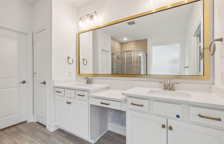 Dual vanity in owner's bathroom *real home pictured