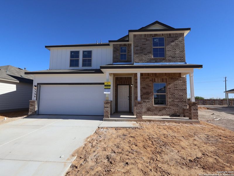 Front exterior of a new home in Agave, San Antonio, TX, highlighting curb appeal (Image 2). Front exterior of a new home in Agave, San Antonio, TX, highlighting curb appeal (Image 2).