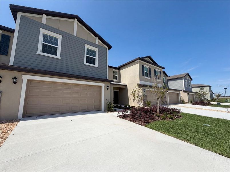 Front exterior of a new home in , Parrish, FL, highlighting curb appeal (Image 20). Front exterior of a new home in , Parrish, FL, highlighting curb appeal (Image 20).