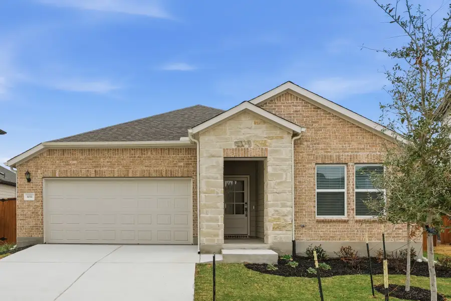 Representative exterior photo of a completed home built from the Meadowlark by Taylor Morrison in Longview, Del Valle, TX (Image 3).