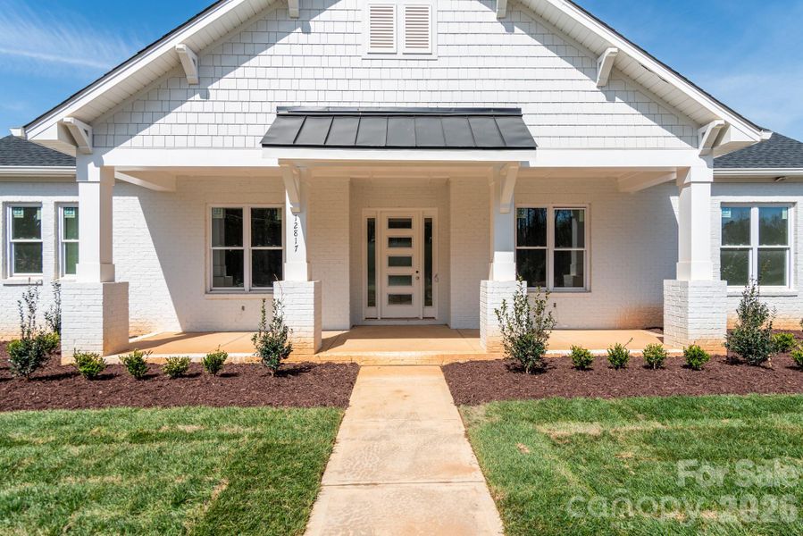 Exterior details and patio area of a home in Bailey's Glen, Huntersville (Image 11).