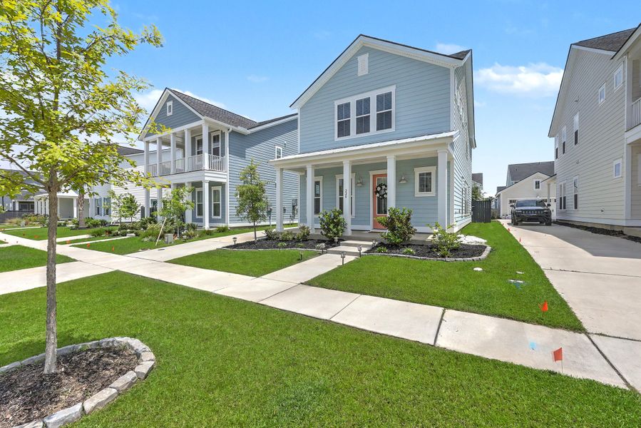 Front exterior of a new home in Carnes Crossroads, Summerville, SC, highlighting curb appeal (Image 2).