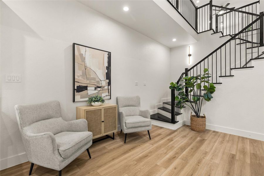 A sitting nook by the staircase — clean architectural lines and room to breathe A sitting nook by the staircase — clean architectural lines and room to breathe