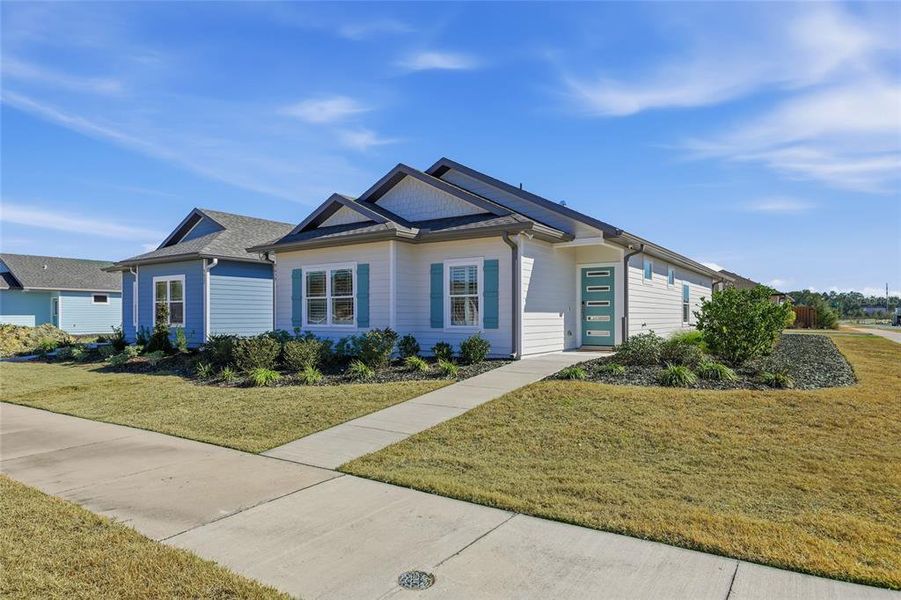 Front exterior of a new home in , Gainesville, FL, highlighting curb appeal (Image 23).