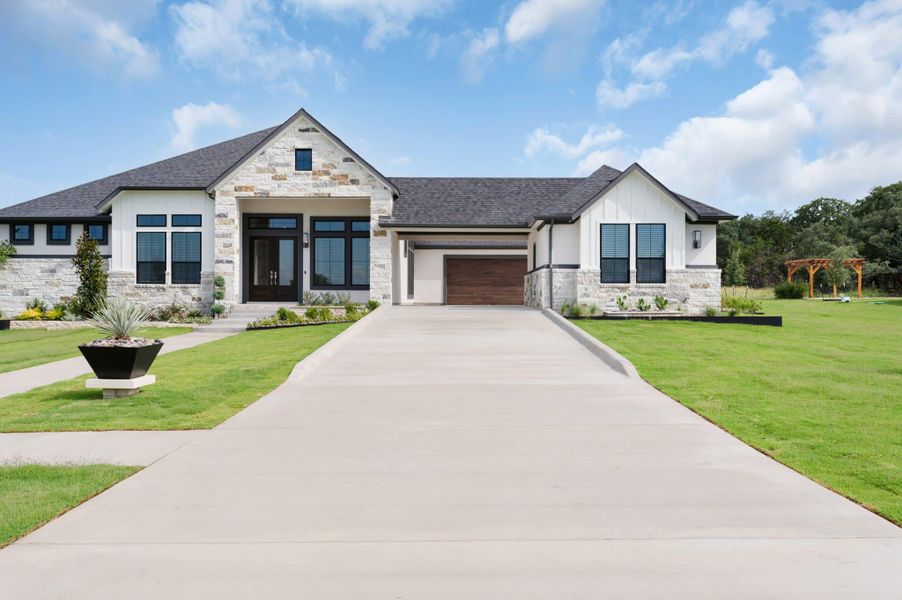 Front exterior of a new home in Feathergrass, Florence, TX, highlighting curb appeal (Image 30).