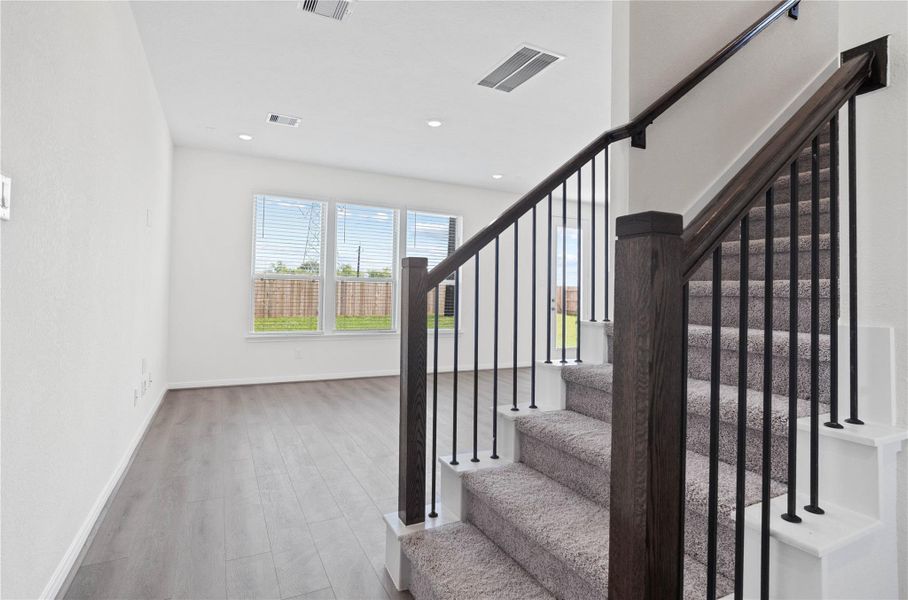 Step into your new home at 22862 Magnolia Haven and be greeted by Warm Grey Layton Lake vinyl plank flooring, a stunning front door with decorative stippolyte glass, and fresh, bright paint—all coming together to create a warm and welcoming entryway. Step into your new home at 22862 Magnolia Haven and be greeted by Warm Grey Layton Lake vinyl plank flooring, a stunning front door with decorative stippolyte glass, and fresh, bright paint—all coming together to create a warm and welcoming entryway.
