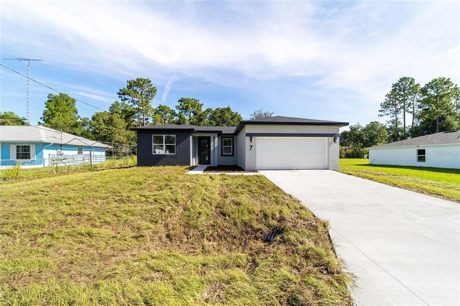 Front exterior of a new home in , Ocala, FL, highlighting curb appeal (Image 29).