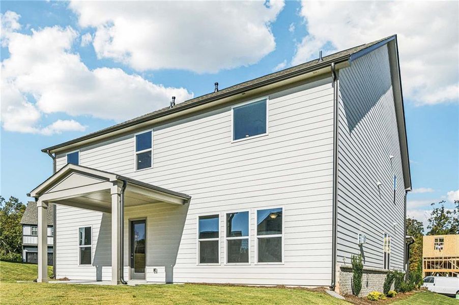 Exterior details and patio area of a home in East Harbor II at Chestatee, Dawsonville (Image 2).