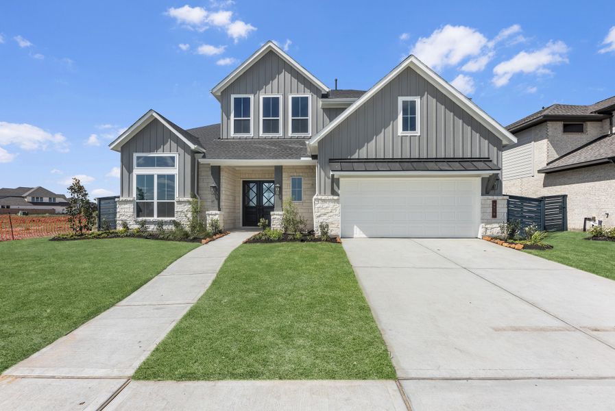 Front exterior of a new home in Austin Point, Richmond, TX, highlighting curb appeal (Image 2). Front exterior of a new home in Austin Point, Richmond, TX, highlighting curb appeal (Image 2).