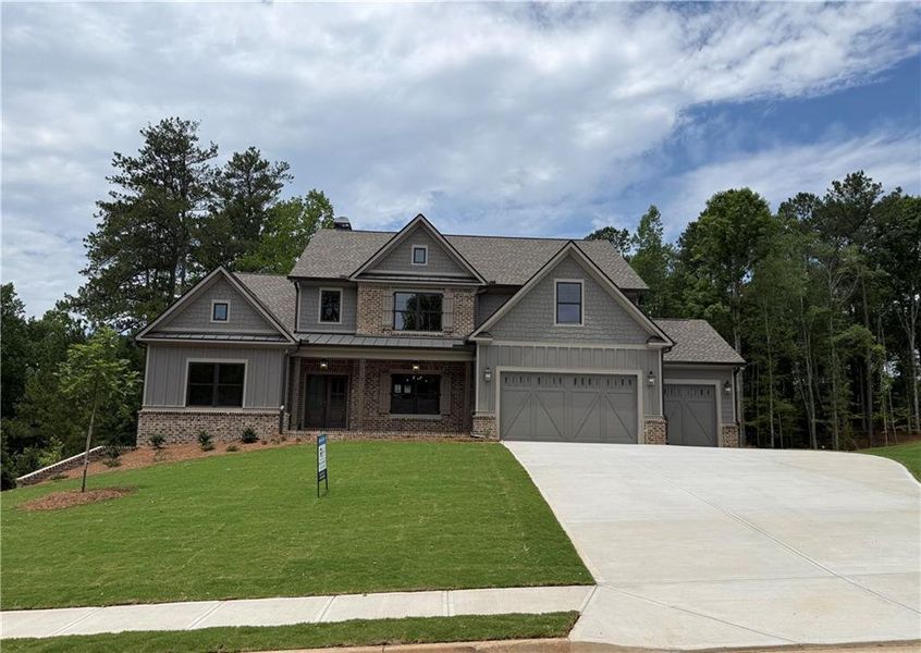 Front exterior of a new home in Spring Creek, Monroe, GA, highlighting curb appeal (Image 3). Front exterior of a new home in Spring Creek, Monroe, GA, highlighting curb appeal (Image 3).
