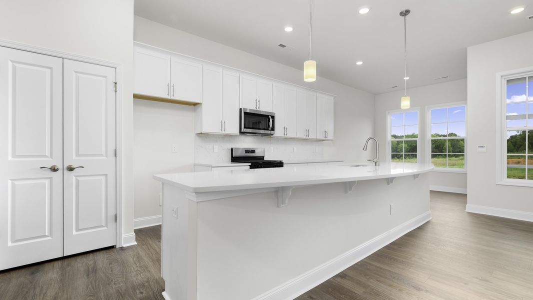 Furnished interior view inside a new home in The Villas at Kinsley, Jamestown (Image 3).