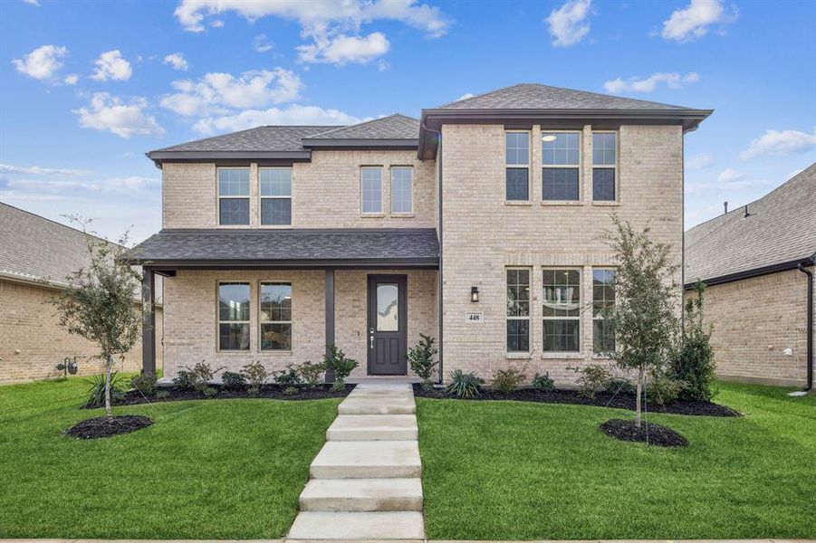 View of front facade with brick siding, a front lawn, and a porch View of front facade with brick siding, a front lawn, and a porch