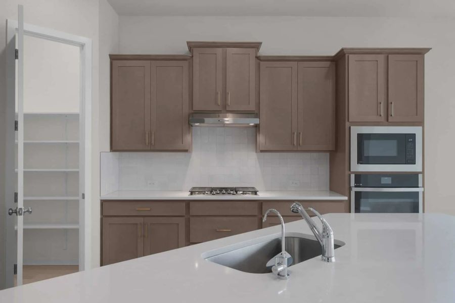 Representative furnished interior of a home built from the Madison by Chesmar Homes in University Heights, McKinney (Image 7).
