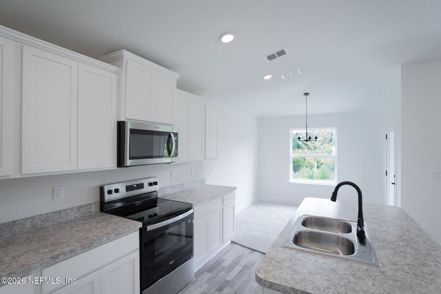 Furnished interior view inside a new home in Summerglen, Jacksonville (Image 6).