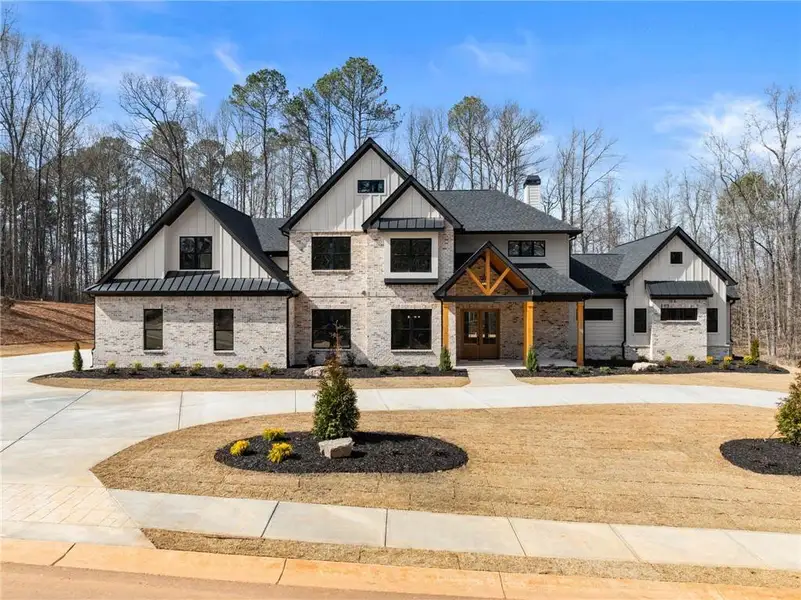 Front exterior of a new home in , Hoschton, GA, highlighting curb appeal (Image 25).