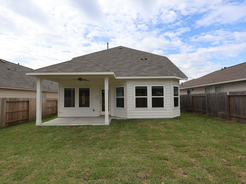 Exterior details and patio area of a home in Magnolia Ridge, Magnolia (Image 14).