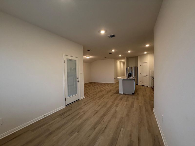 Unfurnished living room with recessed lighting and light wood-style floors Unfurnished living room with recessed lighting and light wood-style floors