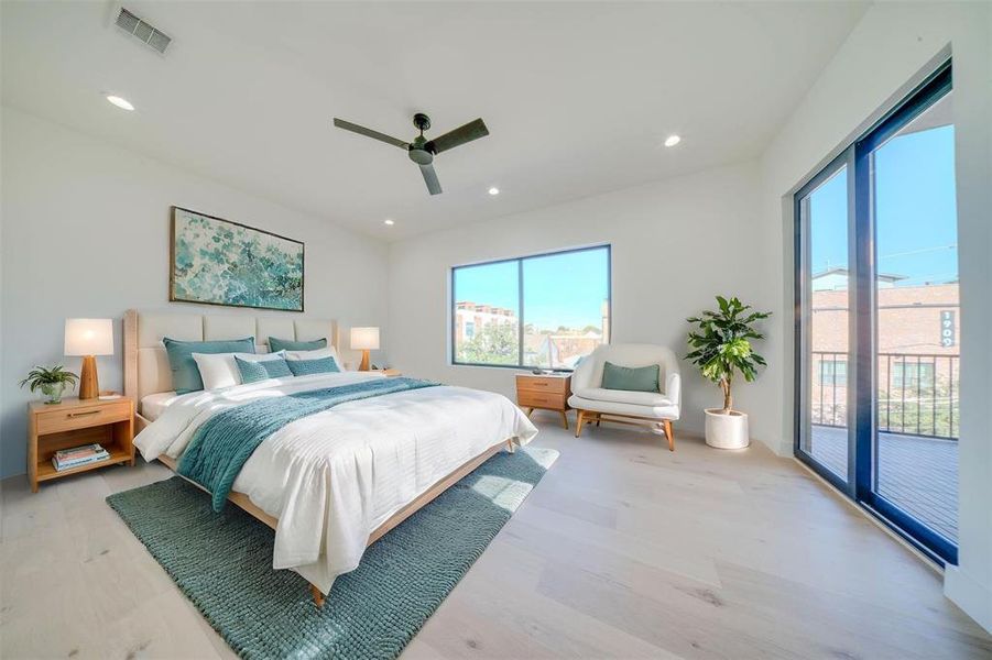 Bedroom with access to exterior, light wood-type flooring, and ceiling fan