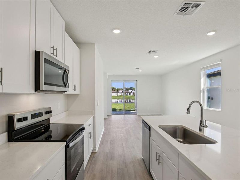Furnished interior view inside a new home in Oakfield Trails - Premier Series, Parrish (Image 7).
