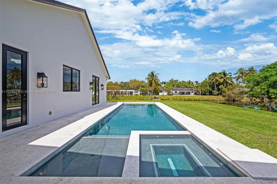 Front exterior of a new home in , Pinecrest, FL, highlighting curb appeal (Image 14).