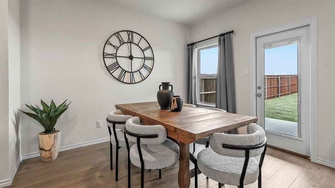 Dining room with wood finished floors and baseboards