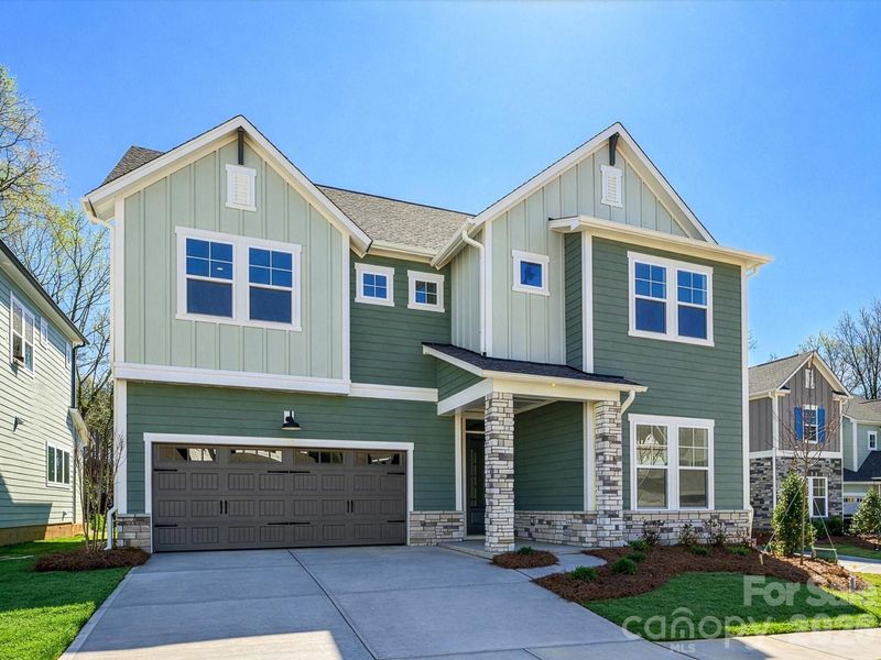 Front exterior of a new home in North Creek Village, Huntersville, NC, highlighting curb appeal (Image 21).