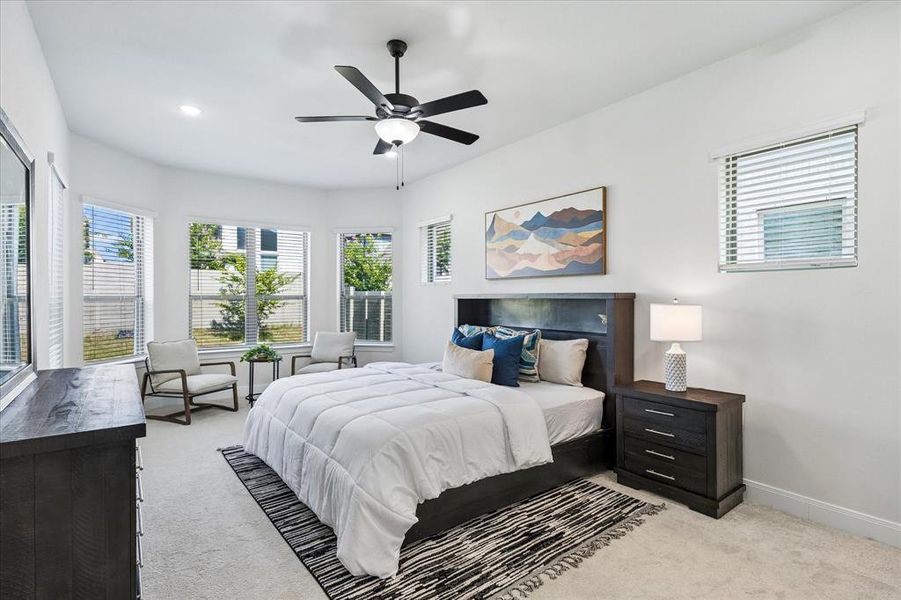 Spacious room featuring light-toned carpeting and bright white walls Spacious room featuring light-toned carpeting and bright white walls
