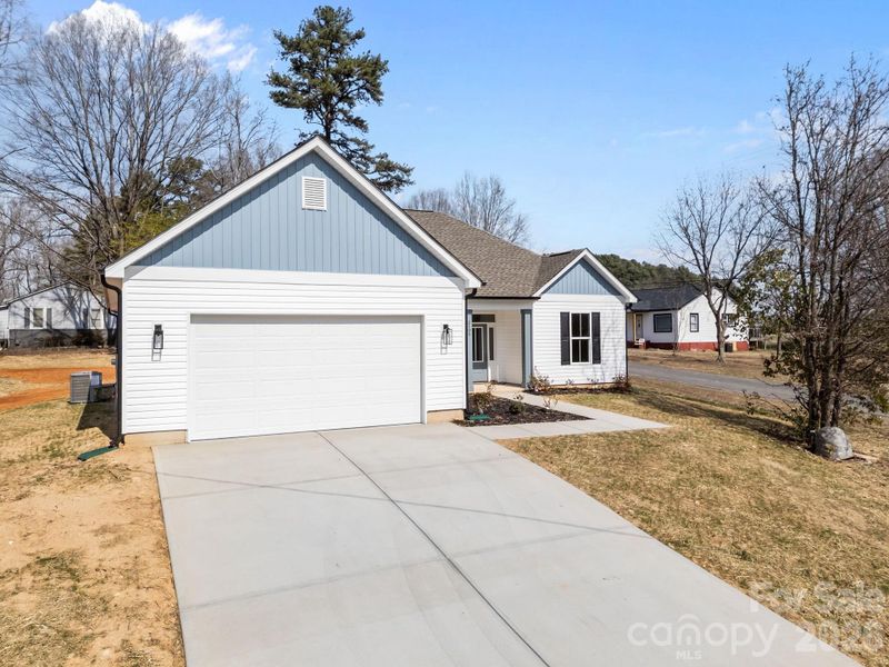 Front exterior of a new home in , Kannapolis, NC, highlighting curb appeal (Image 20). Front exterior of a new home in , Kannapolis, NC, highlighting curb appeal (Image 20).
