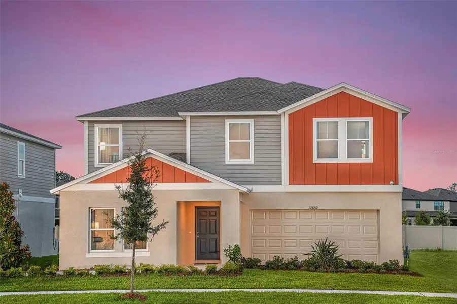 Front exterior of a new home in Lawson Dunes, Haines City, FL, highlighting curb appeal (Image 1). Front exterior of a new home in Lawson Dunes, Haines City, FL, highlighting curb appeal (Image 1).