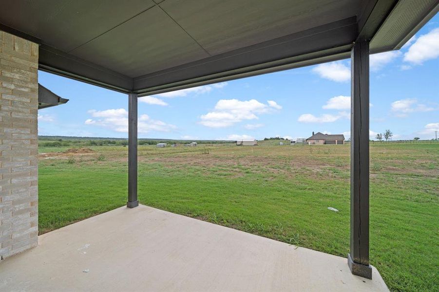 View of patio with a rural view