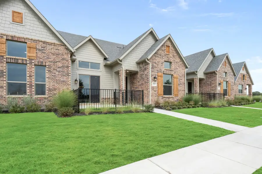 Front exterior of a new home in Cottonwood Creek, Rowlett, TX, highlighting curb appeal (Image 28).