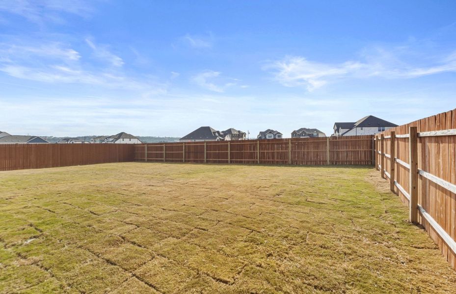 Exterior details and patio area of a home in Saddleback at Santa Rita Ranch, Liberty Hill (Image 27).