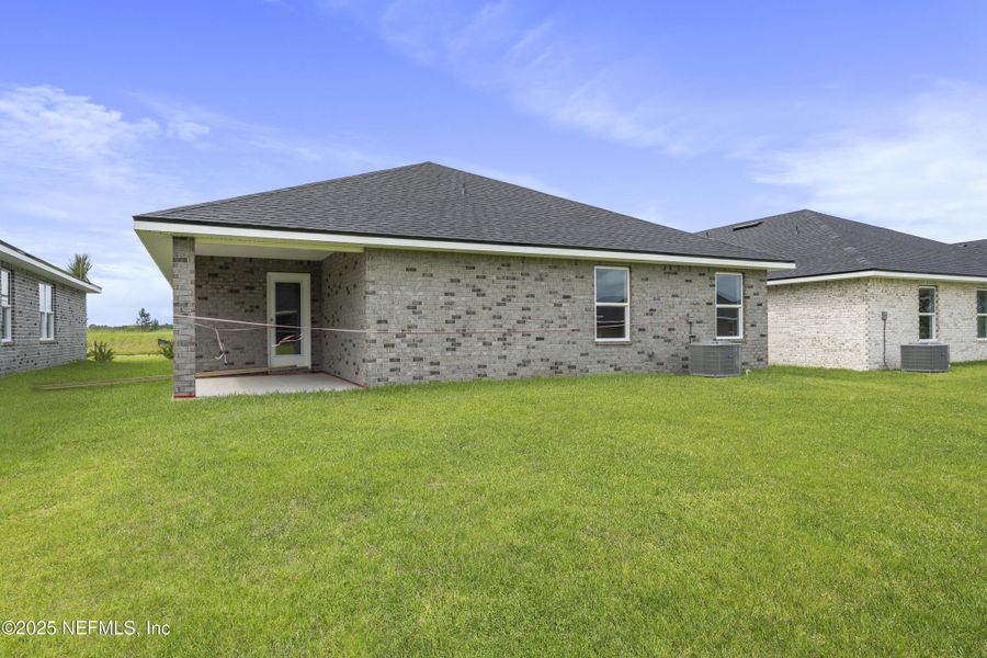 Front exterior of a new home in Shadow Crest at Rolling Hills, Green Cove Springs, FL, highlighting curb appeal (Image 16).