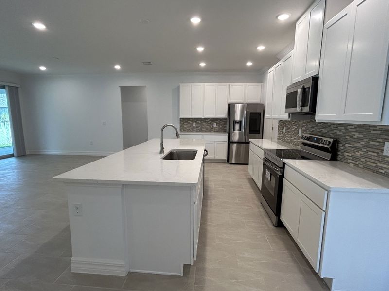 Furnished interior view inside a new home in Burnt Store, Cape Coral (Image 3). Furnished interior view inside a new home in Burnt Store, Cape Coral (Image 3).