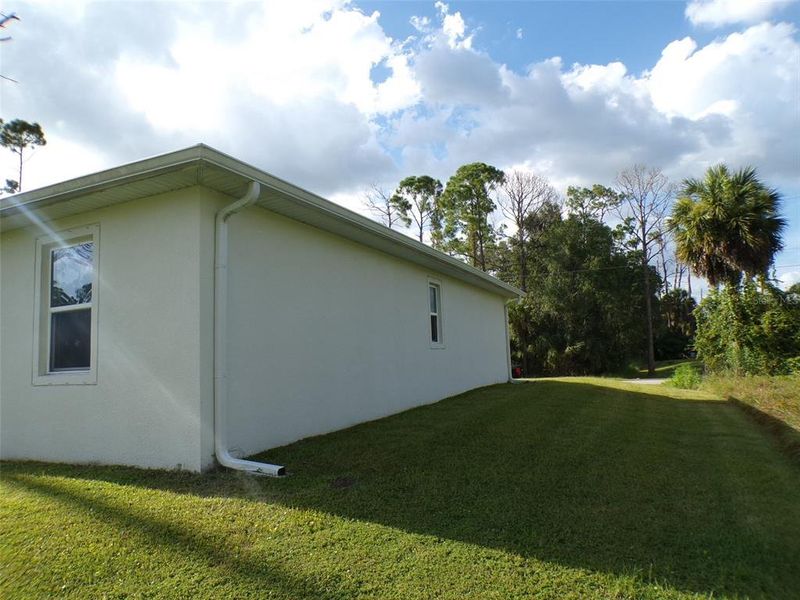 Exterior details and patio area of a home in , North Port (Image 24).