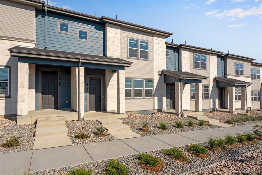 Front exterior of a new home in , Arvada, CO, highlighting curb appeal (Image 21).