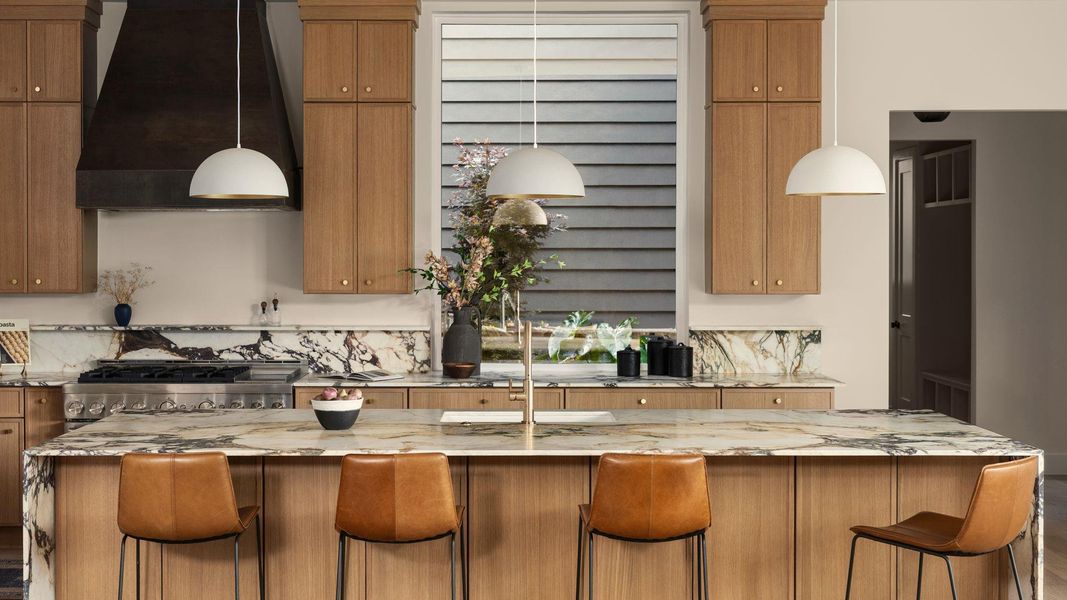 Italian Calacutta Monet marble countertops, the atrium and custom hood vent Italian Calacutta Monet marble countertops, the atrium and custom hood vent