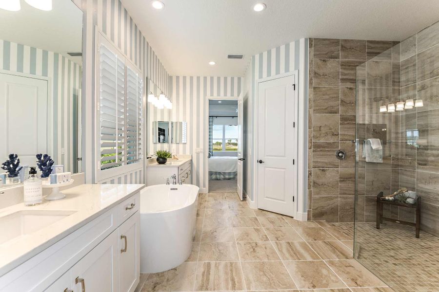 Representative furnished interior of a home built from the Kiawah 2 by Neal Communities in SkySail, Naples (Image 12).