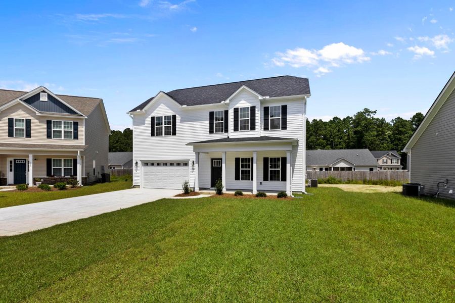 Representative exterior photo of a completed home built from the Tyler A by JC Jackson Homes,LLC in Heritage Pointe, Newport, NC (Image 20).