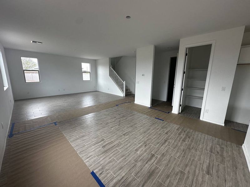 Great room with kitchen and stairs to loft