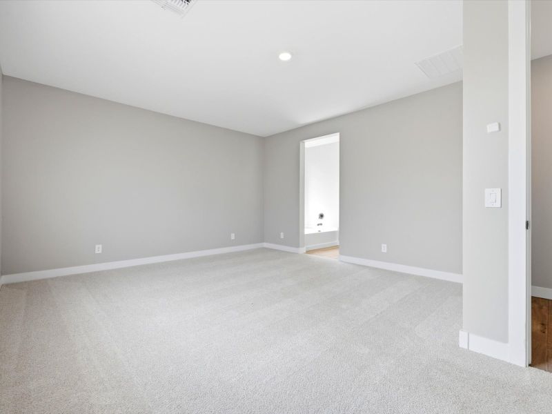 Spacious, unfurnished interior of a new home in White Tank Foothills Signature Series, Waddell (Image 14).