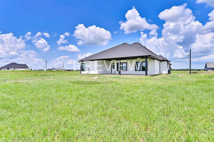 Front exterior of a new home in , Angleton, TX, highlighting curb appeal (Image 25).