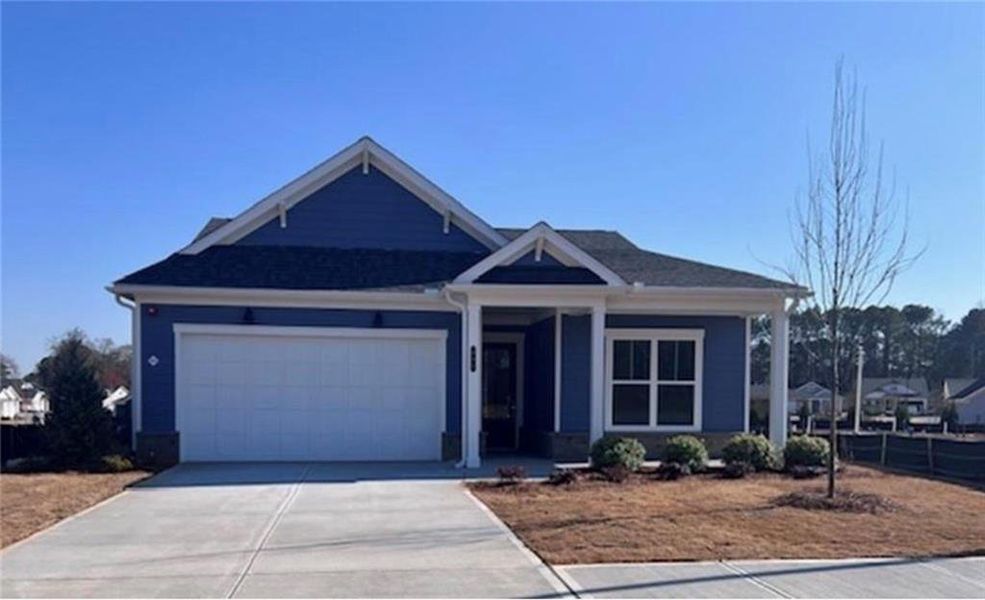 Front exterior of a new home in The Reserve at Bells Ferry, Kennesaw, GA, highlighting curb appeal (Image 1).